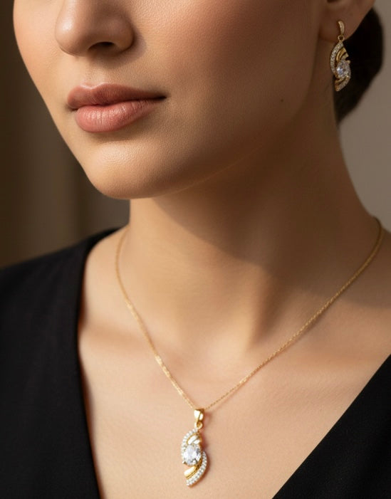 Elegant Gold Crystal Twist Pendant & Earrings Set – Luxury Shine