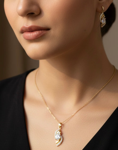 Elegant Gold Crystal Twist Pendant & Earrings Set – Luxury Shine