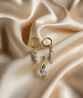 Elegant Gold Crystal Twist Pendant & Earrings Set – Luxury Shine