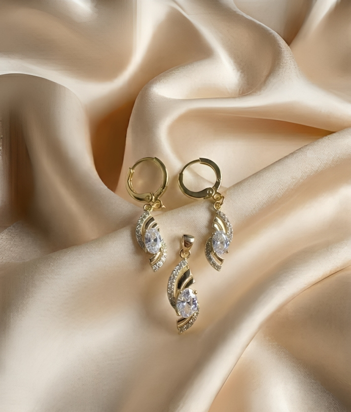 Elegant Gold Crystal Twist Pendant & Earrings Set – Luxury Shine