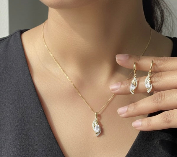 Elegant Gold Crystal Twist Pendant & Earrings Set – Luxury Shine