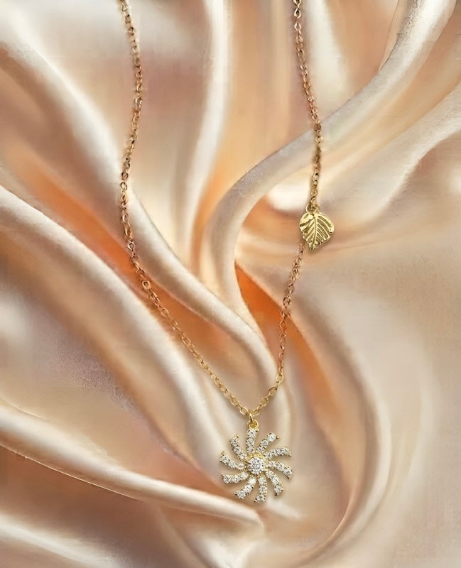 Luxury Gold Sunburst Crystal Pendant Necklace – Leaf Charm Design